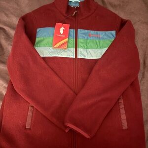 Cotopaxi Burgundy Jacket with Vibrant Stripes